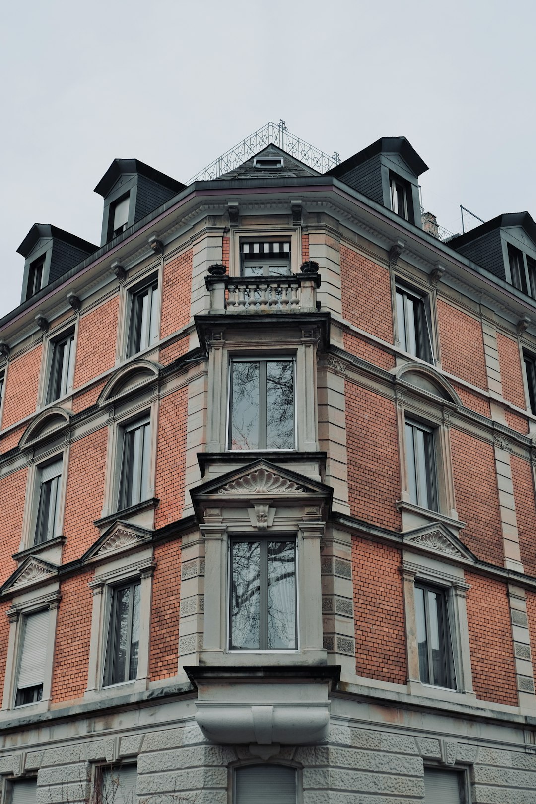 a-tall-brick-building-with-a-clock-on-the-top-of-it-q72ezqjqg7k
